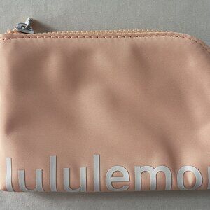 Lululemon Clippable Card Pouch with key ring attached. - Peach color